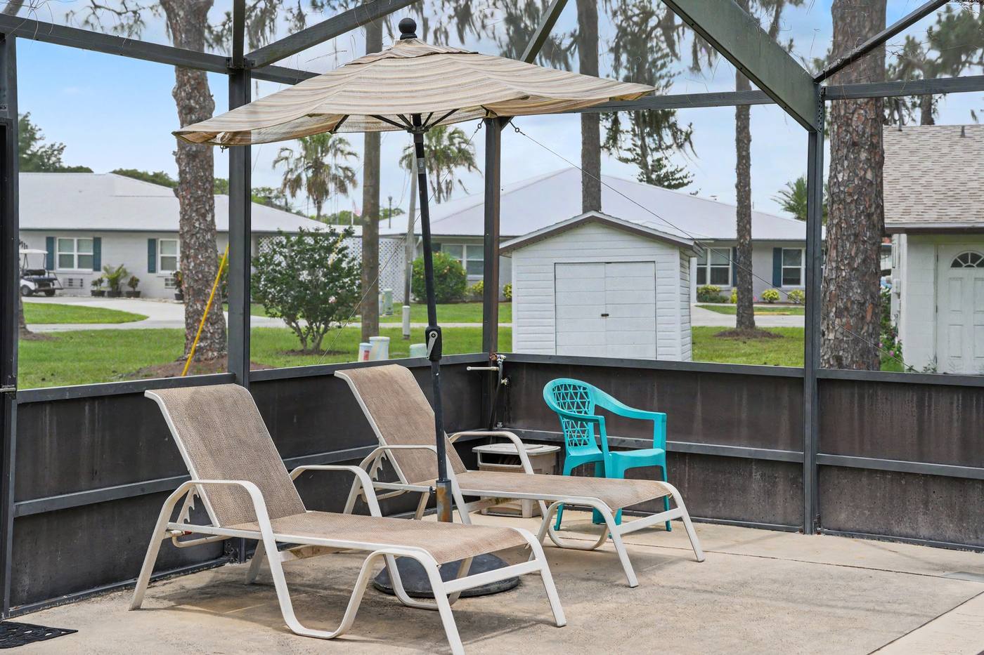 Lounge chairs and an umbrella on the pool deck